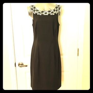 Black dress with embellished neckline